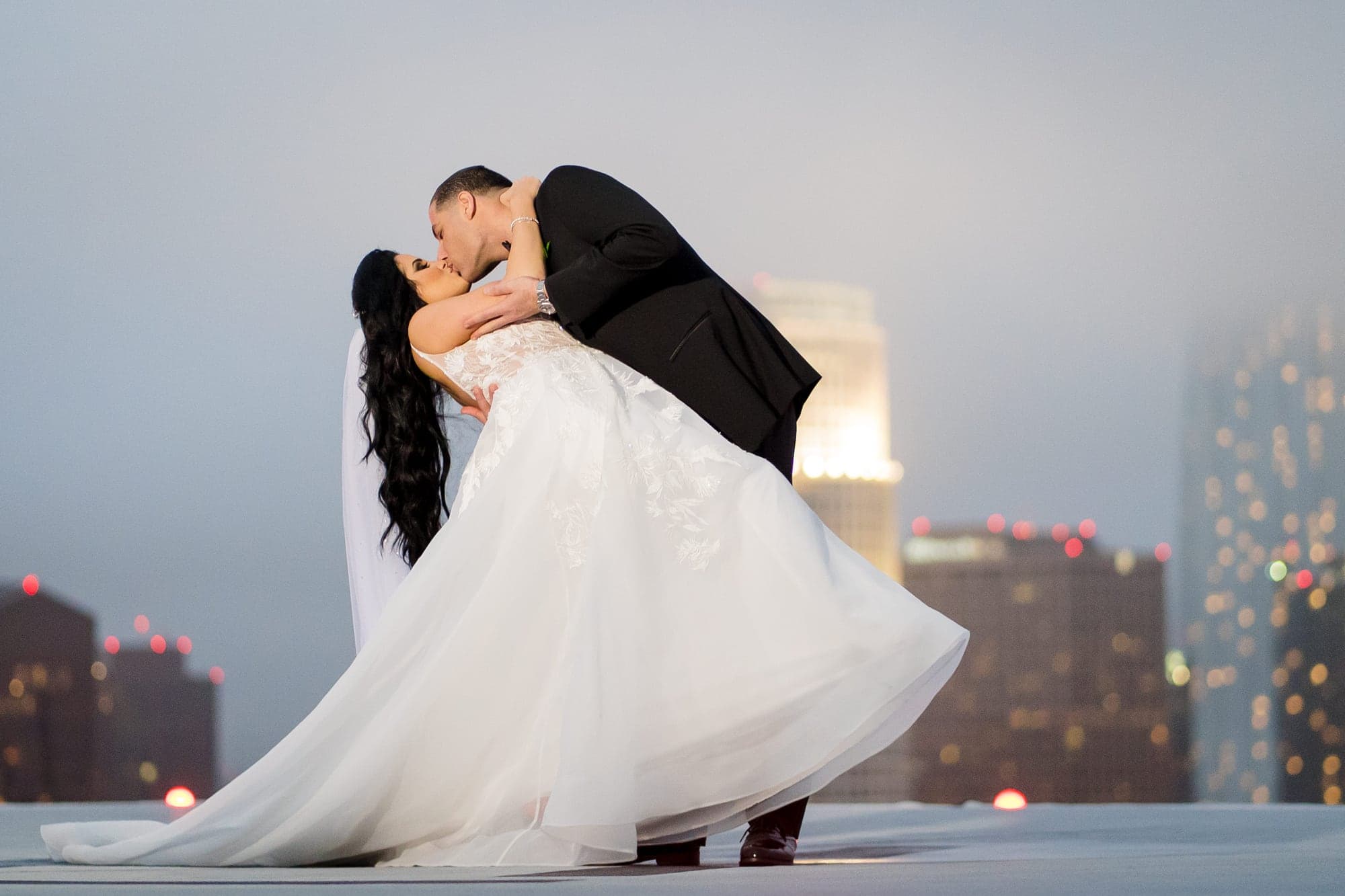 Christina and Sahak beneath a dramatic sky at South Park Center