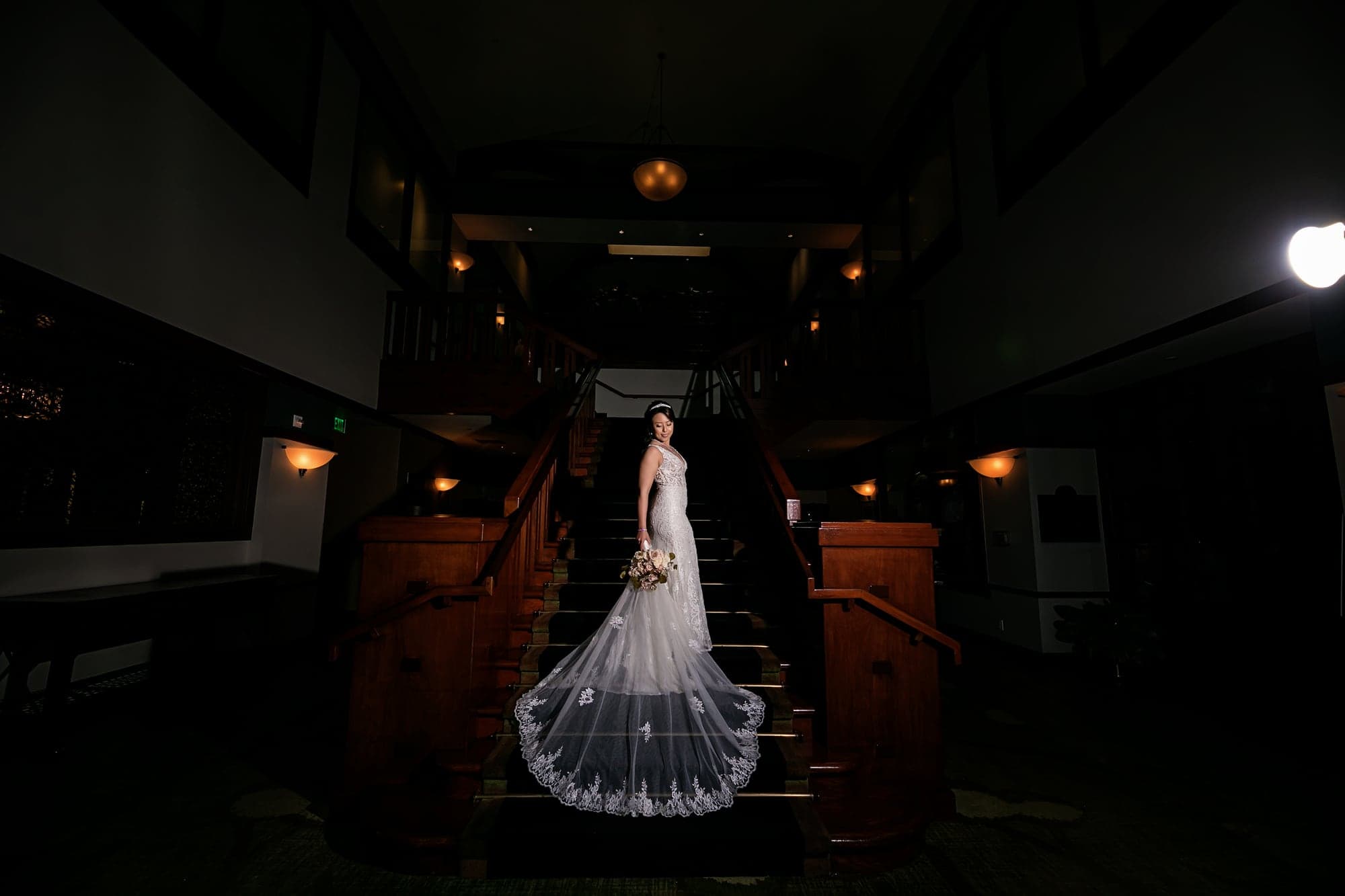 Bride framed inside the lodge at dusk