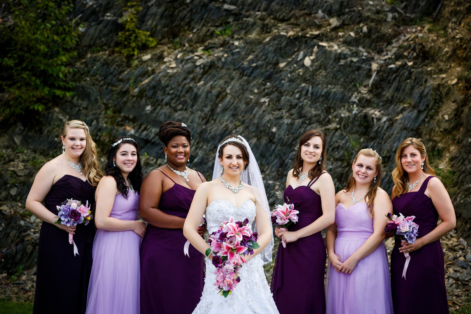 The bride and her purple-clad wedding party