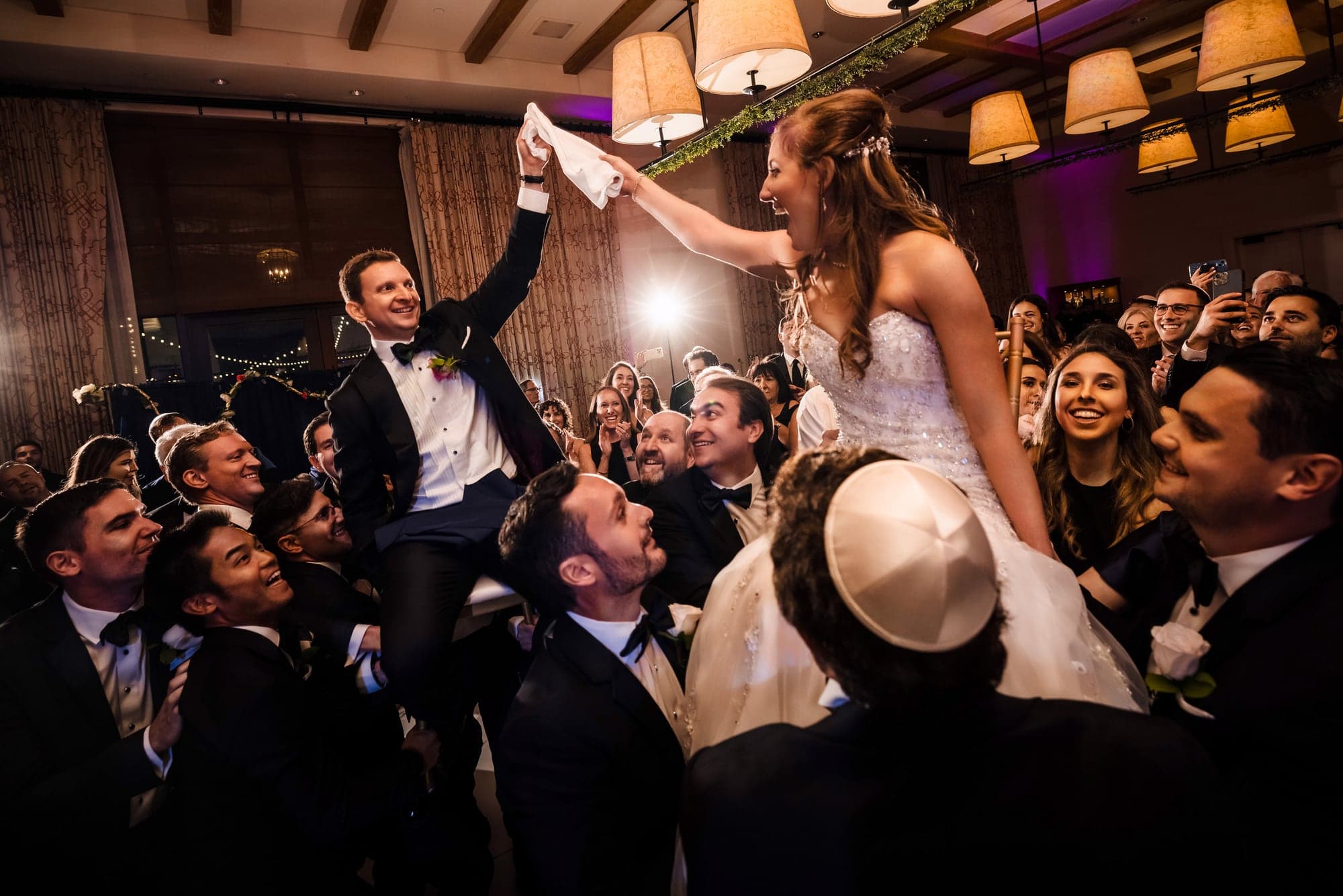Sarah and Daniel lifted above their guests during the hora at the Terranea Resort reception