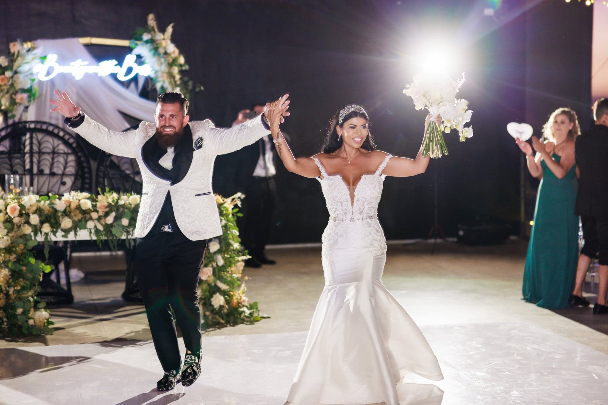Bryanna and Justin dancing beneath a canopy of lights at their Cabo reception