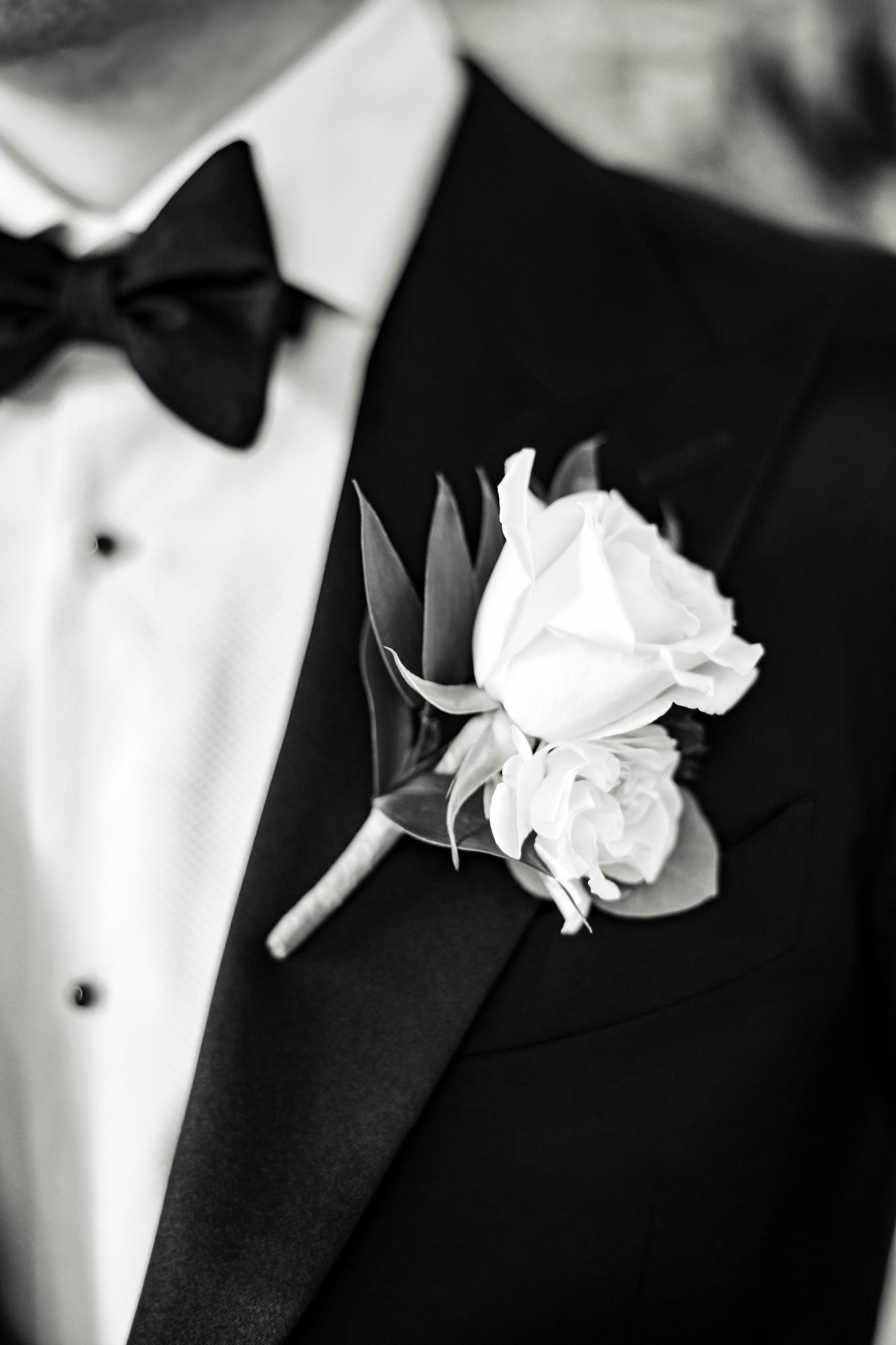 Austin fastening his jacket, photographed in black and white