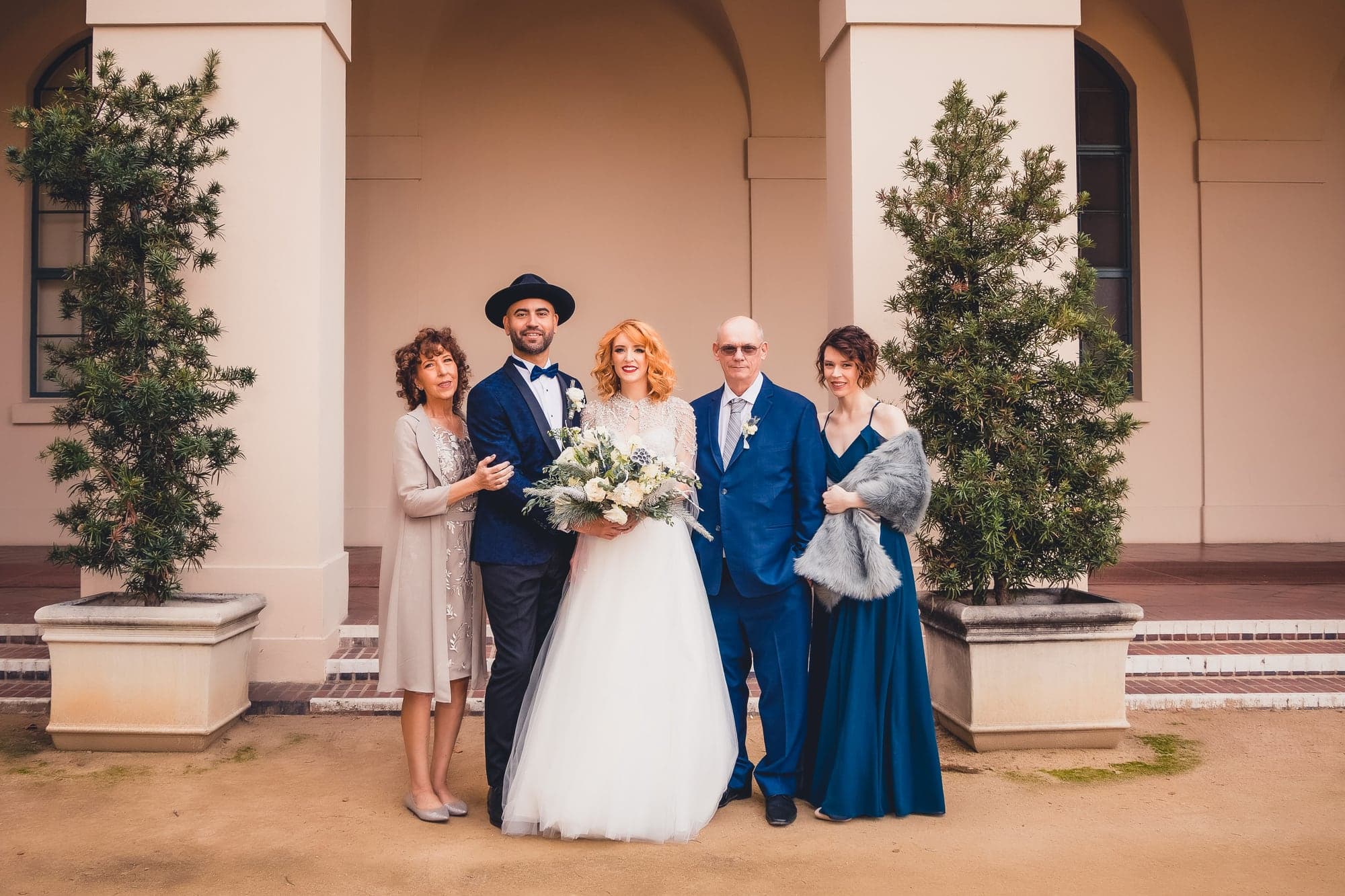 Melissa and Aaron with family in the courtyard