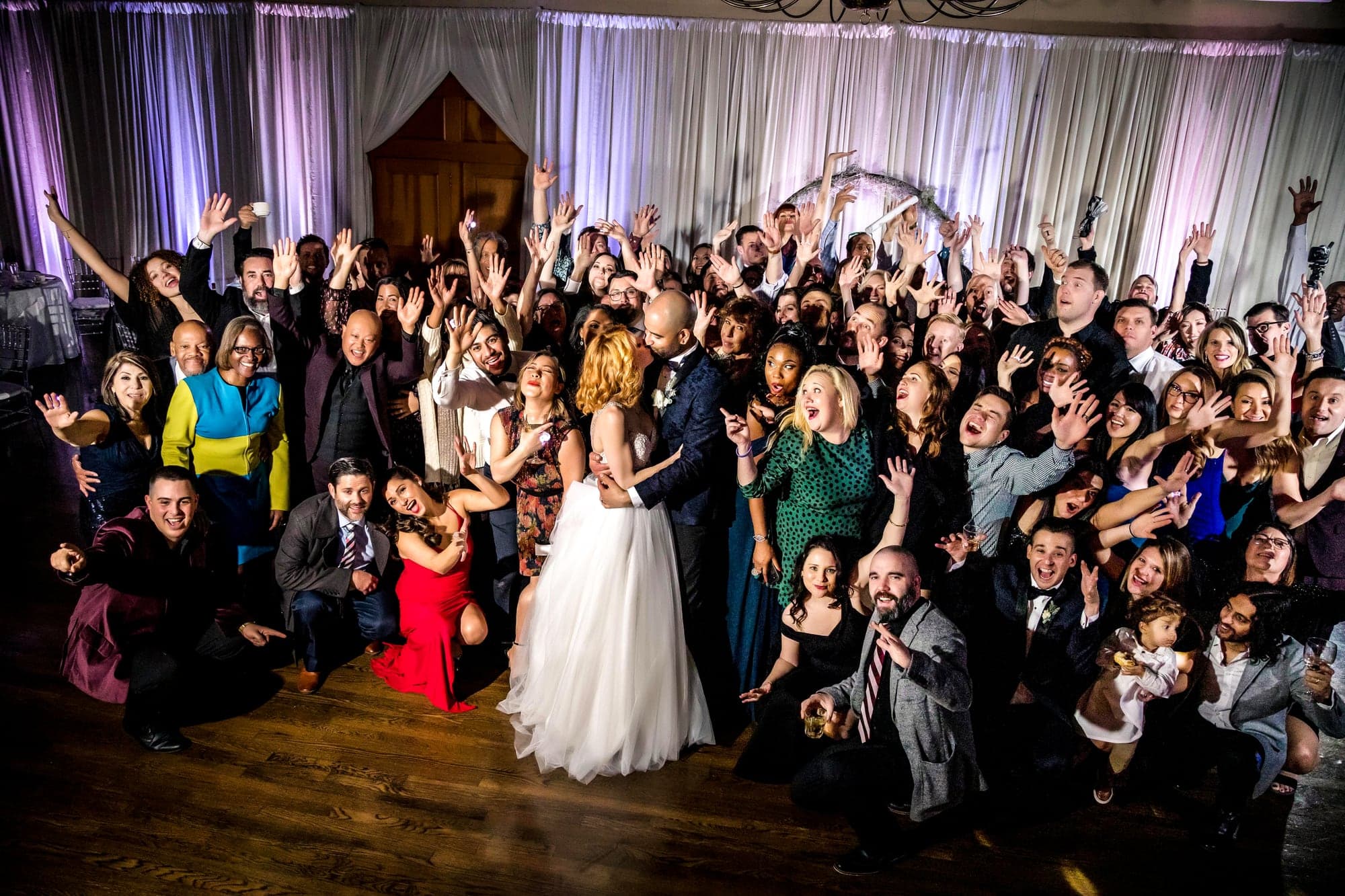 Melissa and Aaron surrounded by guests on the dance floor