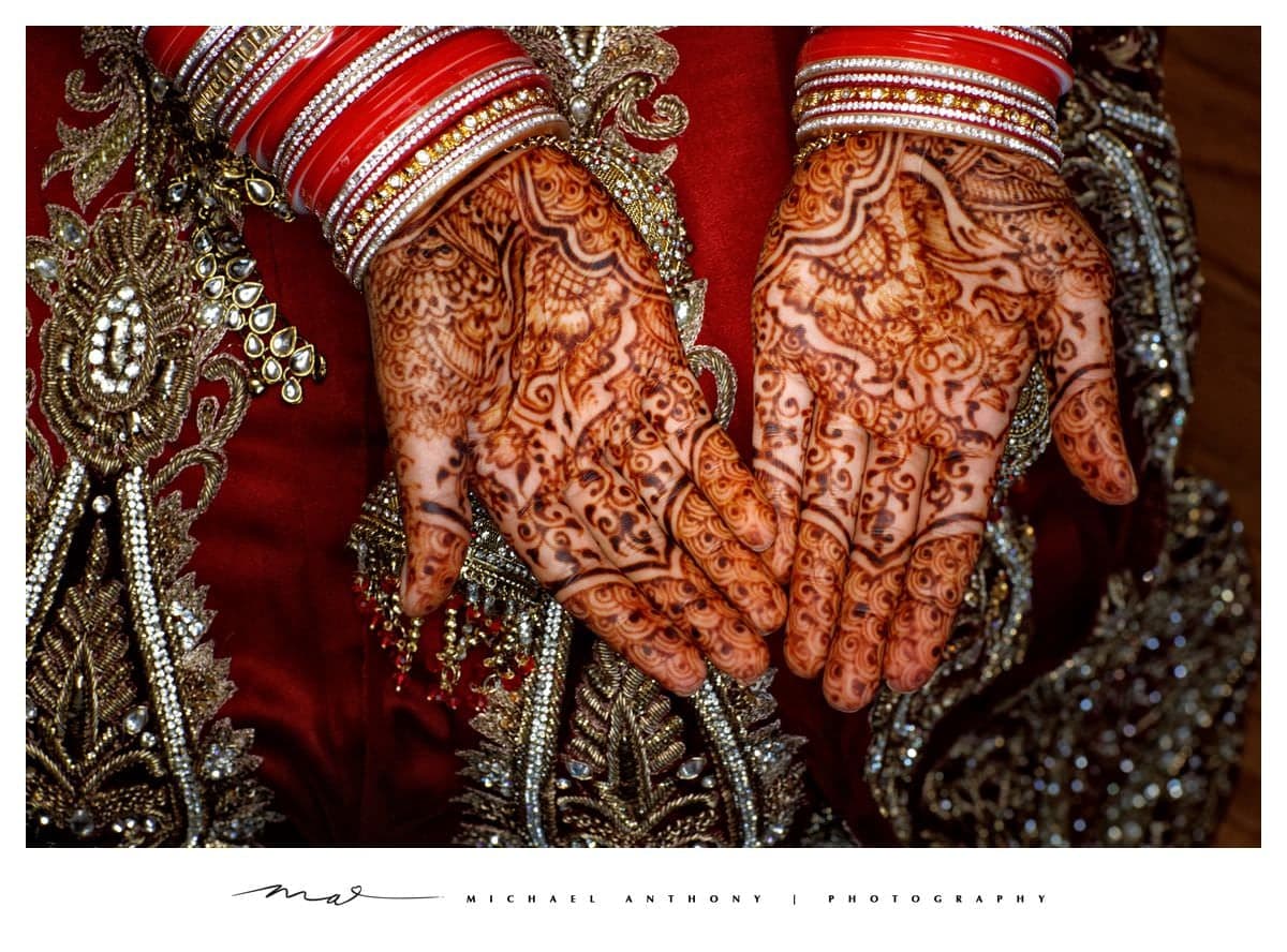 Detailed bridal henna and red wedding bangles