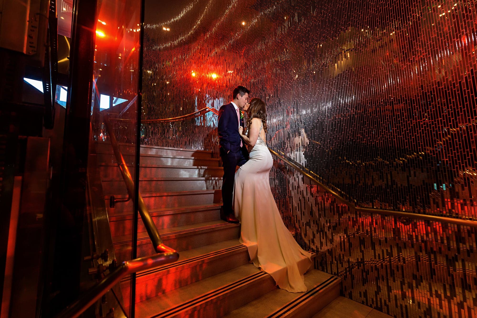 Dramatic red lit wedding portrait at Vertigo Event Venue