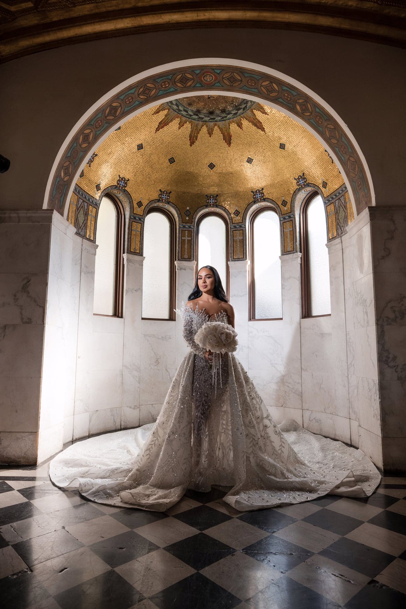 Afrika posed beneath Vibiana's historic archways with her long train extended behind her