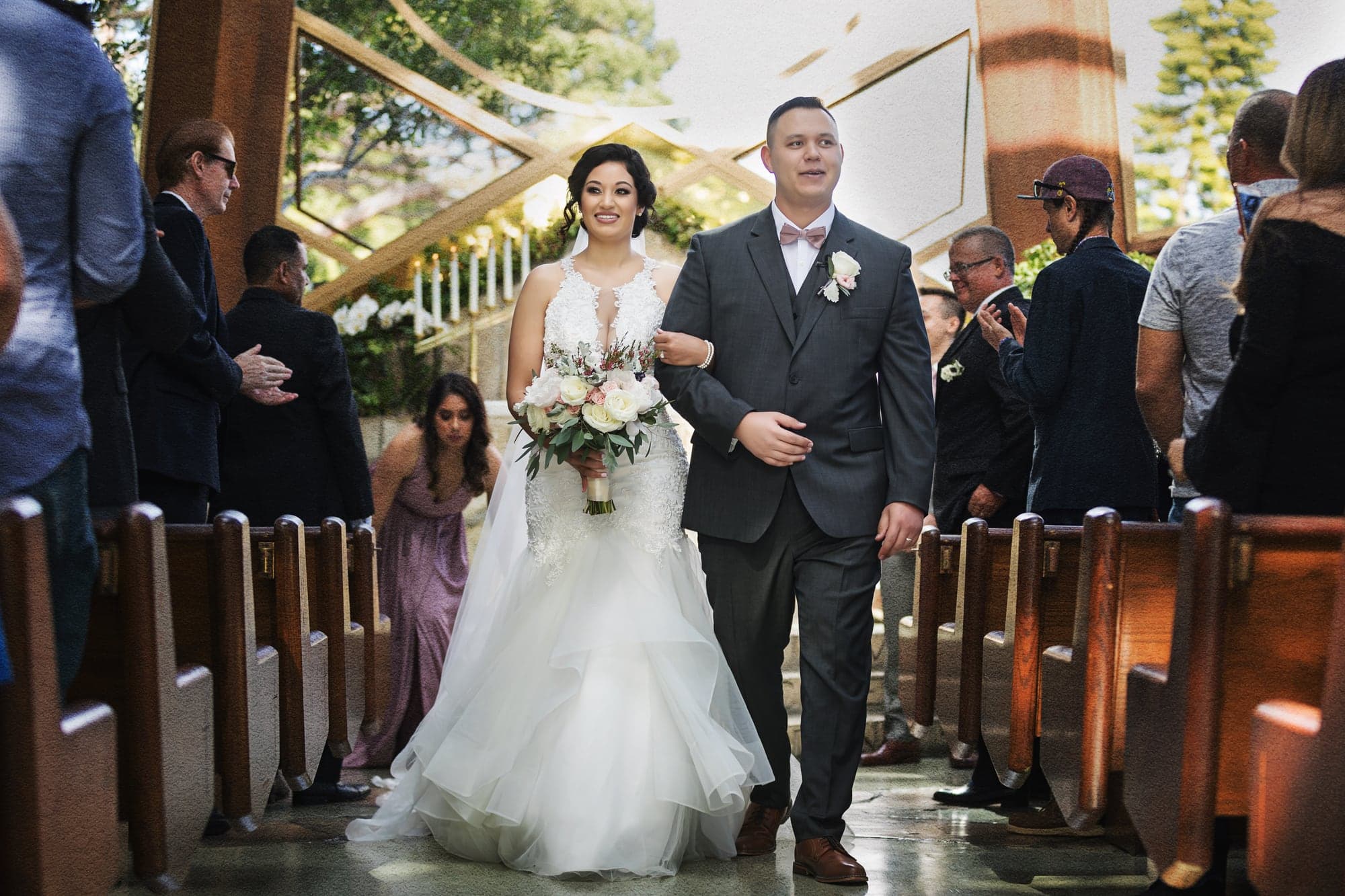 Bride walking down the church aisle with her father