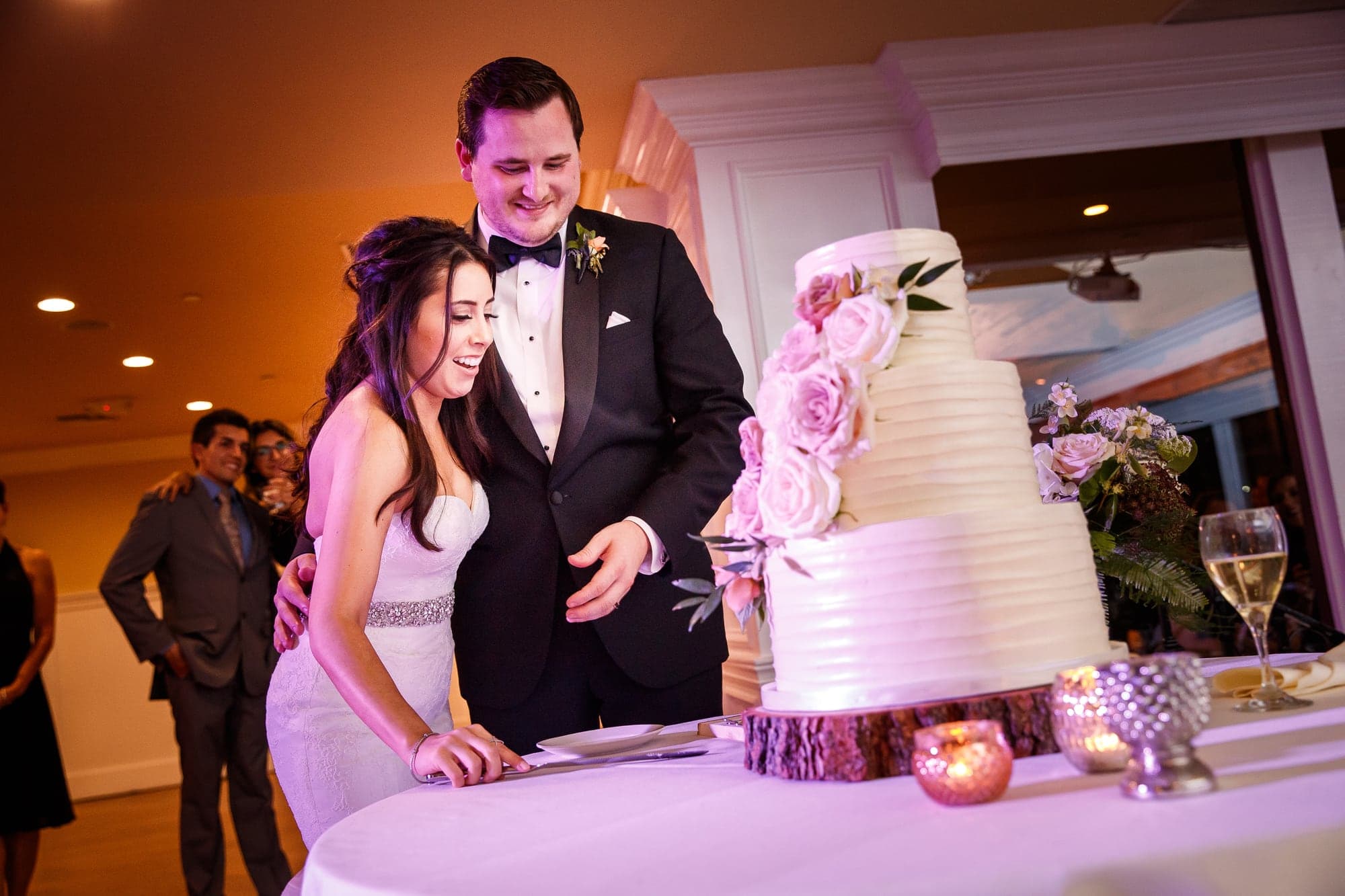 The newlyweds cutting their wedding cake