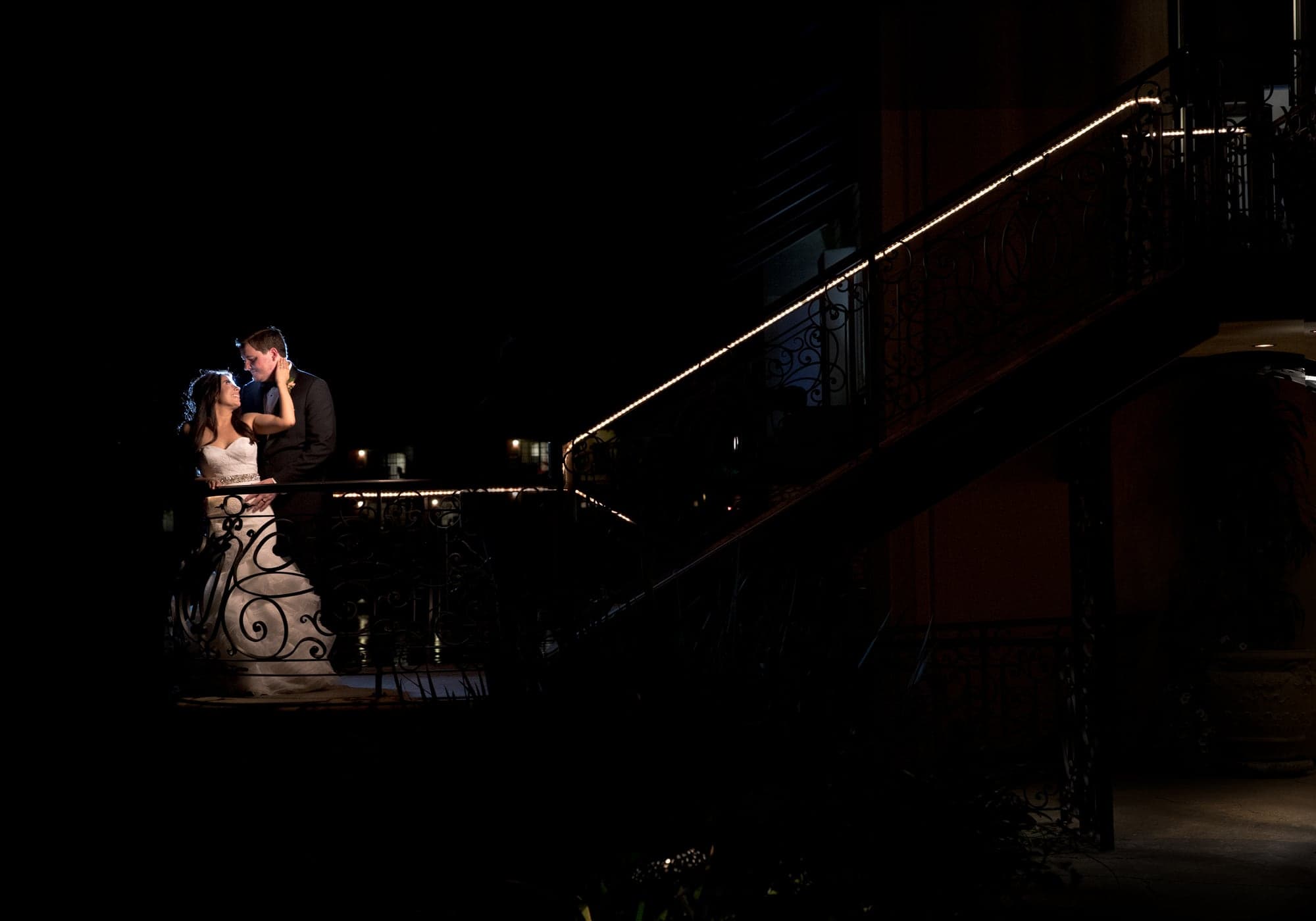 Brittany and Andrew in a nighttime fountain portrait