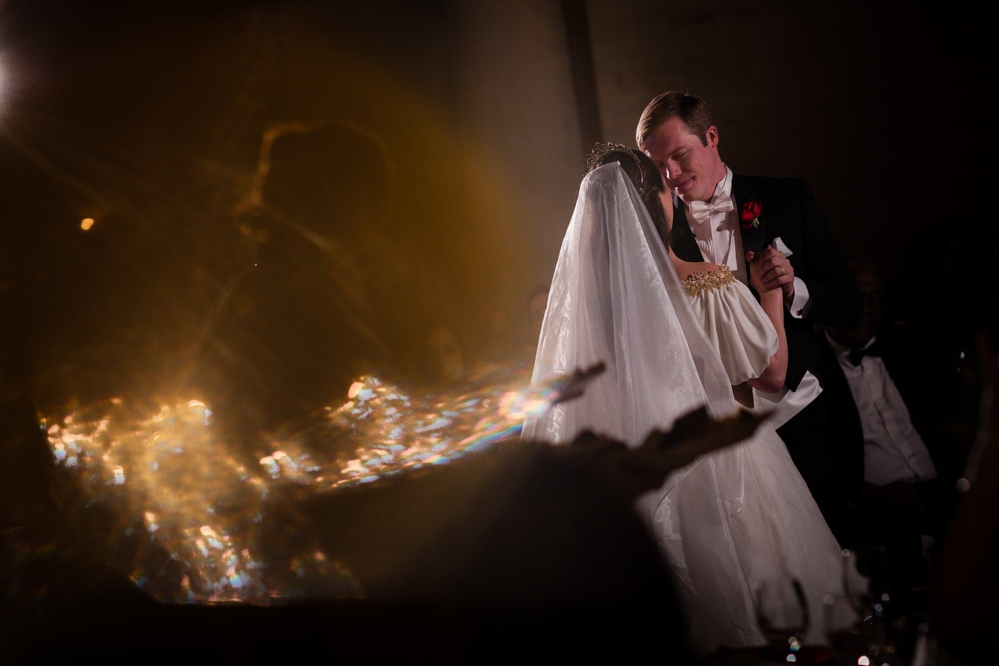 Bride and groom surrounded by warm light after the ceremony