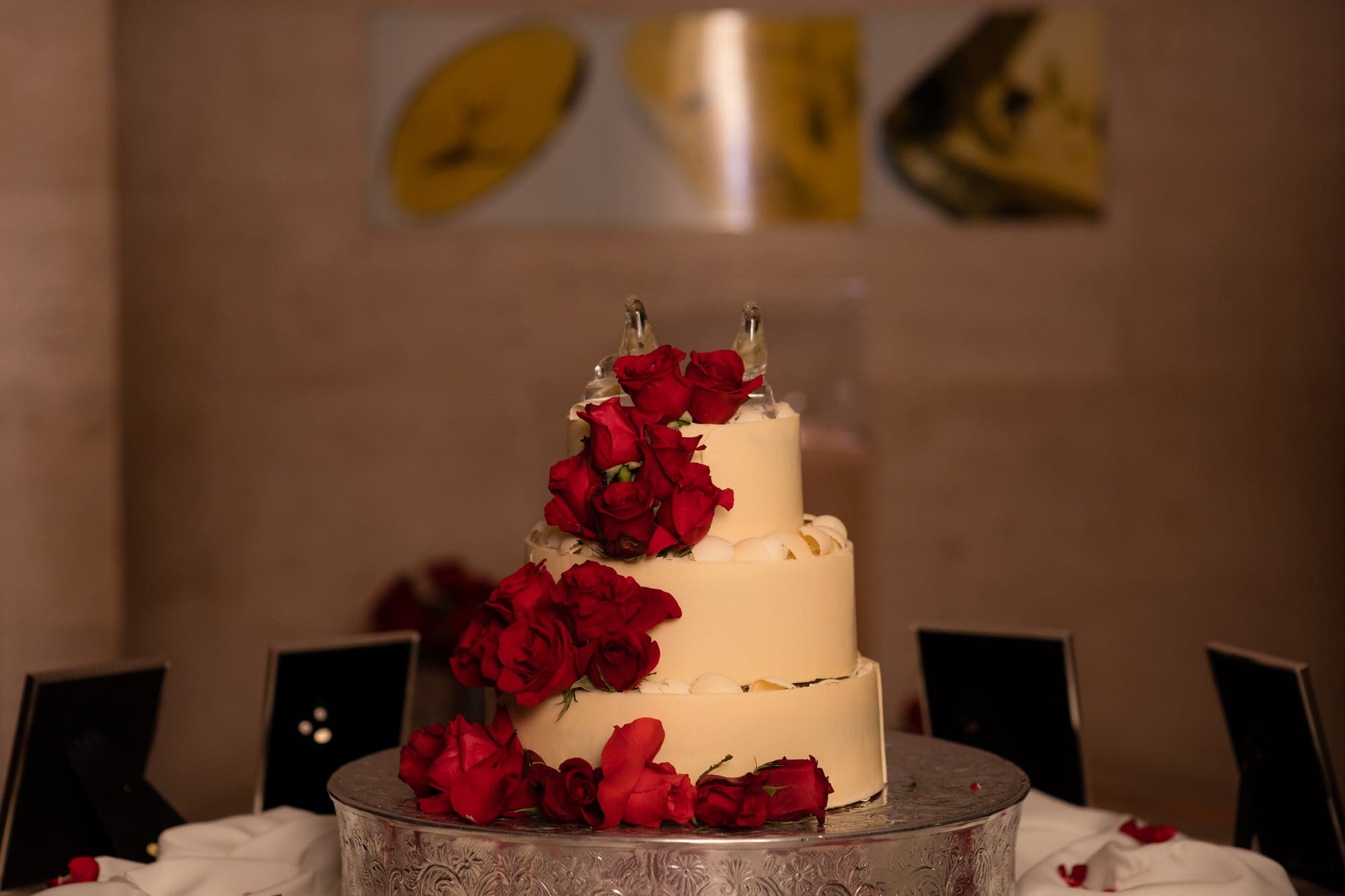 Wedding cake decorated with red roses