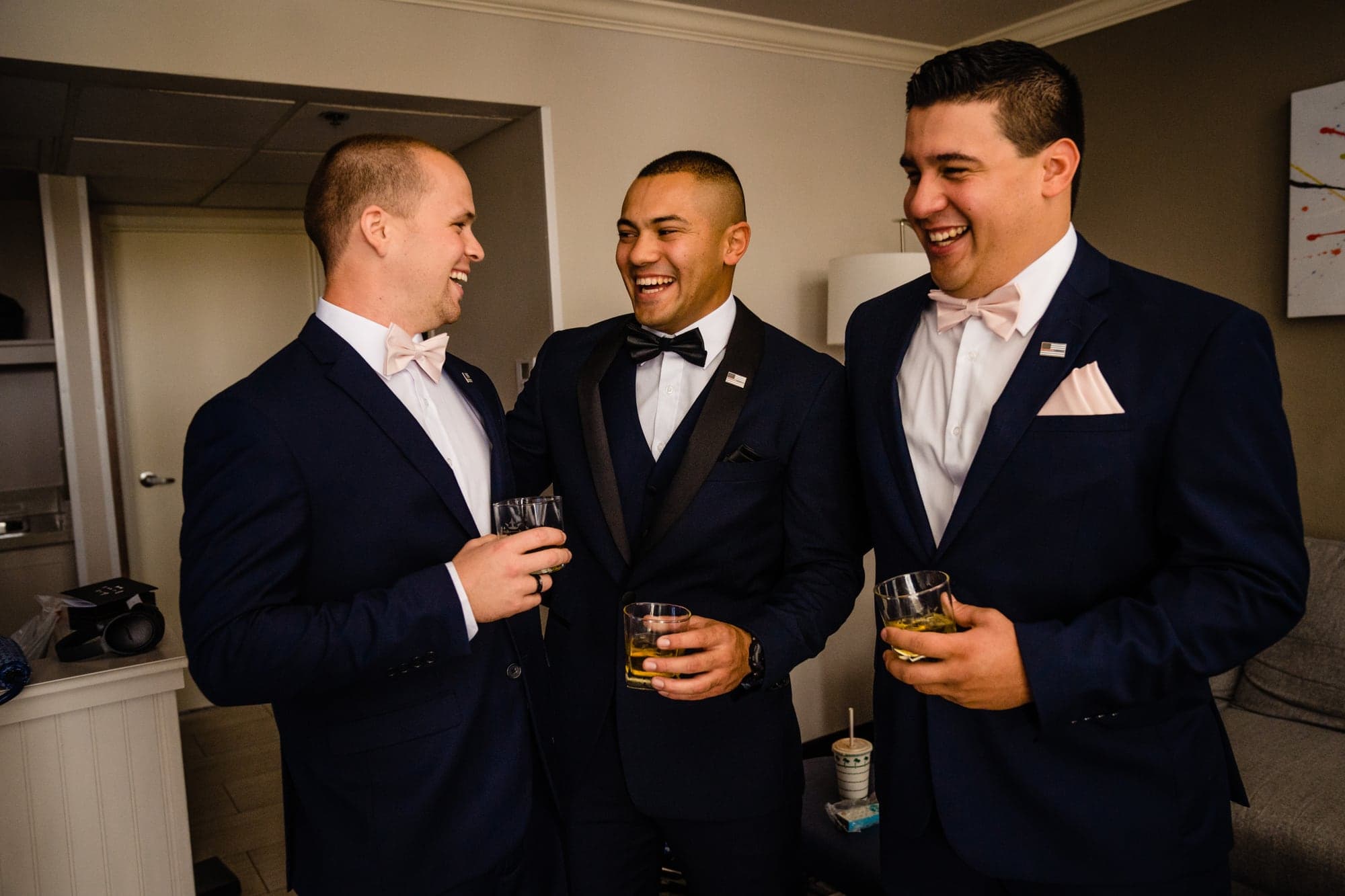 The groom and wedding party in navy suits