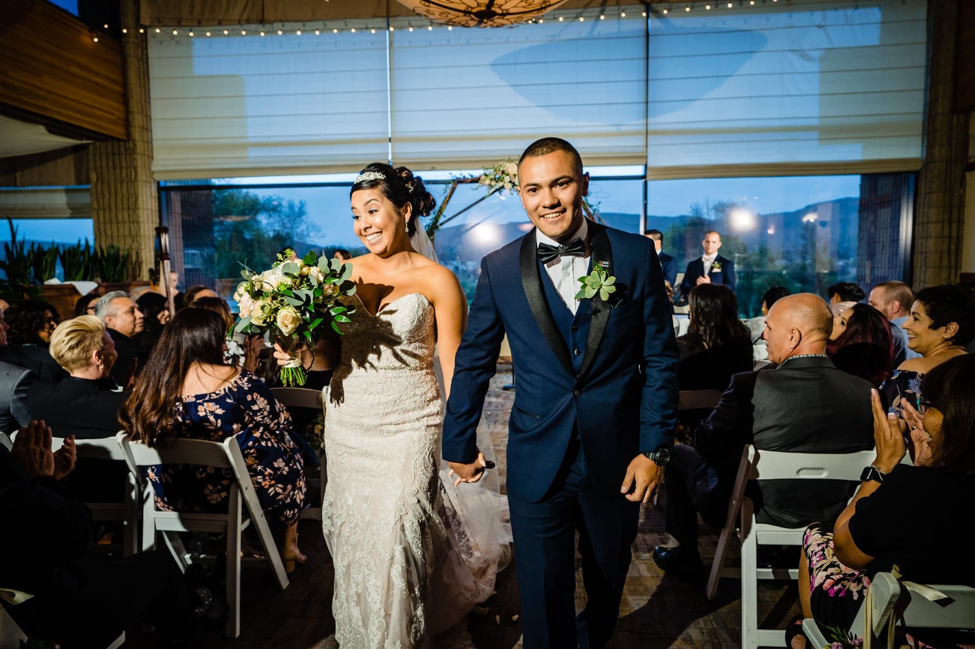 The newlyweds walking into their reception